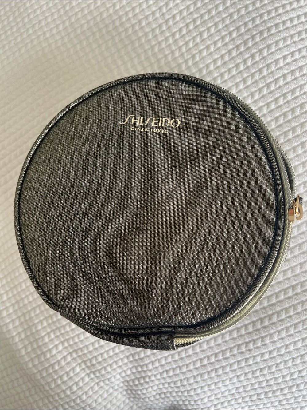 Shiseido Black Round Travel Toiletry Case with Gold Logo